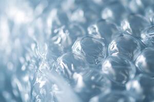 Close-up view of bubble wrap texture highlighting bubbles and reflections in natural light photo