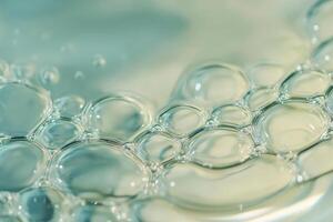 Bubbles floating on the surface of clear water create a mesmerizing pattern in natural light photo