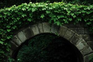 A stone archway covered in vibrant green ivy in a tranquil forest setting during daylight photo