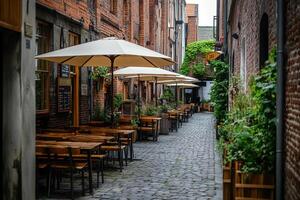 Charming cobblestone alleyway lined with cafes and outdoor seating in a historic district photo
