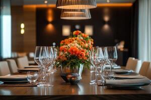 Elegant dining setup with floral centerpiece and crystal glassware in a modern restaurant setting photo