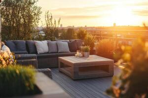 Comfortable rooftop terrace at sunset with cozy seating and plants overlooking the city skyline photo