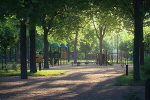 Quiet morning in a vibrant park playground surrounded by lush trees and soft sunlight photo