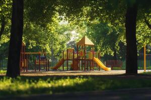 Playground surrounded by trees in a sunlit park during afternoon hours photo