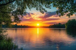 Golden sunset over serene lake reflecting vibrant colors in the evening sky photo