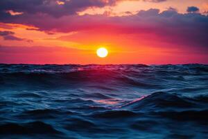 Vibrant sunset over gentle ocean waves with cloudy sky in a serene coastal setting photo