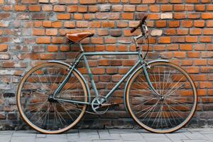 Vintage bicycle leaning against a textured brick wall in an urban setting photo