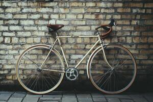 Vintage bicycle leaning against a textured brick wall in a quiet urban alleyway photo