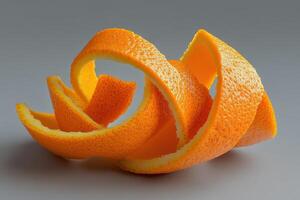 Artistic arrangement of orange peel spirals on a neutral background showcasing intricate textures photo