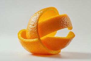 Orange peel artfully arranged on a light background showcasing its vibrant texture and color photo