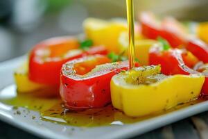 Freshly chopped bell peppers drizzled with olive oil on a plate with herbs and spices photo