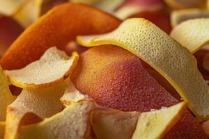 Bright orange and yellow citrus peels arranged closely for a vibrant, textured background photo