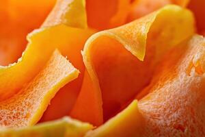 Bright orange carrot peels arranged in a decorative manner at a kitchen countertop photo
