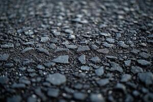 Textured close-up of asphalt ground surface showcasing various sized stones and gravel photo