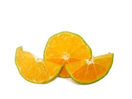 half lemon and slice isolated on white background. orange peel is green. photo