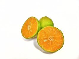 Lemon and slice isolated on white background. orange peel is green photo