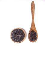 Roasted coffee bean on small wooden bowl and spoon isolated on white background with copy space photo