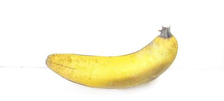 Banana insulated. Ripe yellow banana on a white background. Fresh fruit with copy space photo