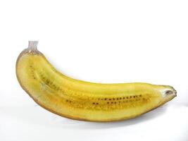 Half banana insulated. Ripe yellow banana on a white background. Fresh fruit with copy space photo