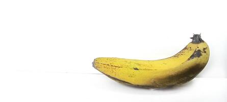 Banana insulated. Ripe yellow banana on a white background. Fresh fruit with copy space photo