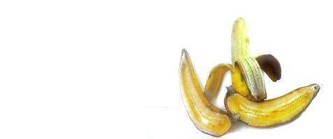 Three banana isolated. Ripe peeled banana on a white background with copy space photo