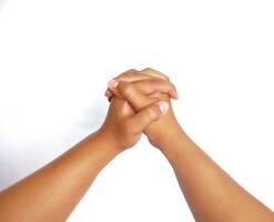 Religion. Man with close palms praying on white background, closeup photo