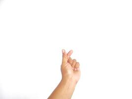 Closeup of male asian hand isolated on white background. Young man forming shape of simple of heart with his fingers. Horizontal color photography. Point of view shot with copy space. photo