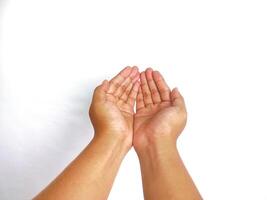 Religion. Man with open palms praying on white background, closeup photo
