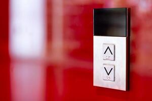 Elevator button on red wall. Elevator Button up and down direction with copy space. photo