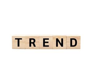 Wooden cube blocks with TREND text isolated on white background. TREND words. Copy space and Clipping path. photo