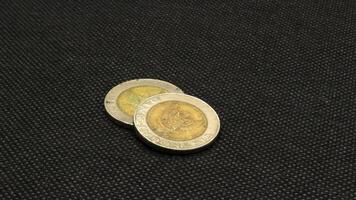 Old Indonesian one thousand rupiah coin isolated photo