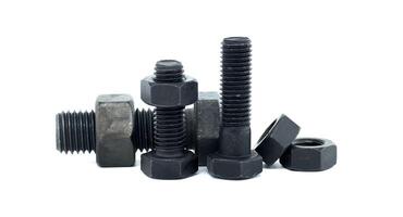 Metal bolts and nuts on white background showcasing industrial equipment and hardware components photo