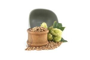 Fresh green hops and grains in rustic display isolated on white background photo
