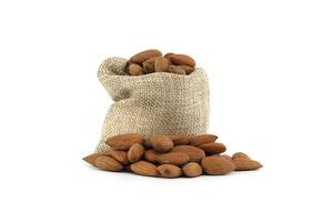 Rustic burlap sack overflowing with fresh almonds photo