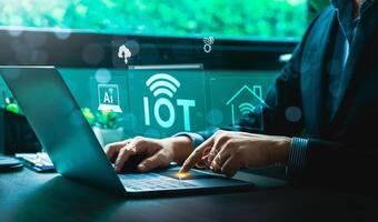 Business Professional Working on Laptop to Manage Internet of Things IoT Network with AI, Cloud, and Smart Home Integration Icons Highlighting Advanced Digital Connectivity and Automation photo