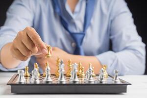 Businessman playing with chess game. Business strategy ideas and investment photo