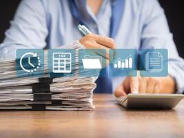 Man using a calculator to calculate tax. An individual income tax payment form photo