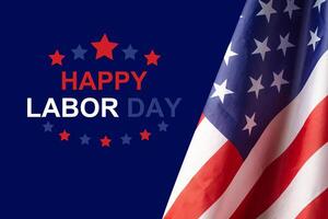 The American flag is on the right side on a blue background with happy labor day text photo