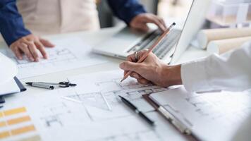 Architecture drawing on architectural project business architecture building construction Colleagues designer Planning Design on blueprint and compasses photo