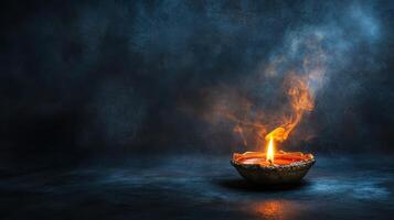 Burning oil lamp on dark background with smoke. Concept of memory, mourning, and remembrance photo