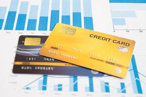 Credit card model on chart and graph spreadsheet paper. photo