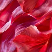 A close-up view reveals vivid red floral textures, with smooth, flowing shapes intermingling. The natural design captivates with its intricate detailing and rich color variations photo