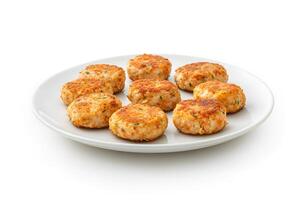 Crab cake cooked scene on a plate on white background photo