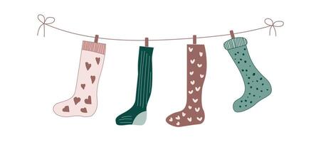 Sock on laundry rope. Christmas stocking with clothespin design isolated on white background. Wool cozy foot cloth hanging and drying. Modern xmas ornament for winter holiday with heart and stripe. vector