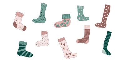 Sock set with Christmas pattern. Winter hosiery template isolated collection design. Holiday drawing with snowflake, heart and xmas tree for cozy autumn day. Long and short different cloth art. vector