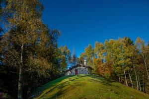 Rustic in the middle of the woods in autumn photo