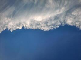 Clouds - during the day, the blue sky is partially covered by thick white clouds, which are expected to become black clouds soon and severe weather is expected. photo