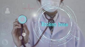 Broken bone text. Doctor using stethoscope on medicine background. Futuristic technology. data hologram healthy concept. video