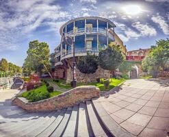 View of the historic city wall in Tbilisi, Georgia, showcasing architecture and greenery photo