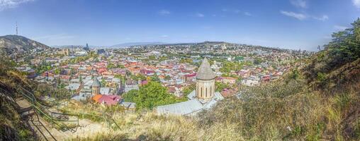 Panoramic daytime view over the city of Tbilisi, Georgia, with colorful rooftops and landmarks photo